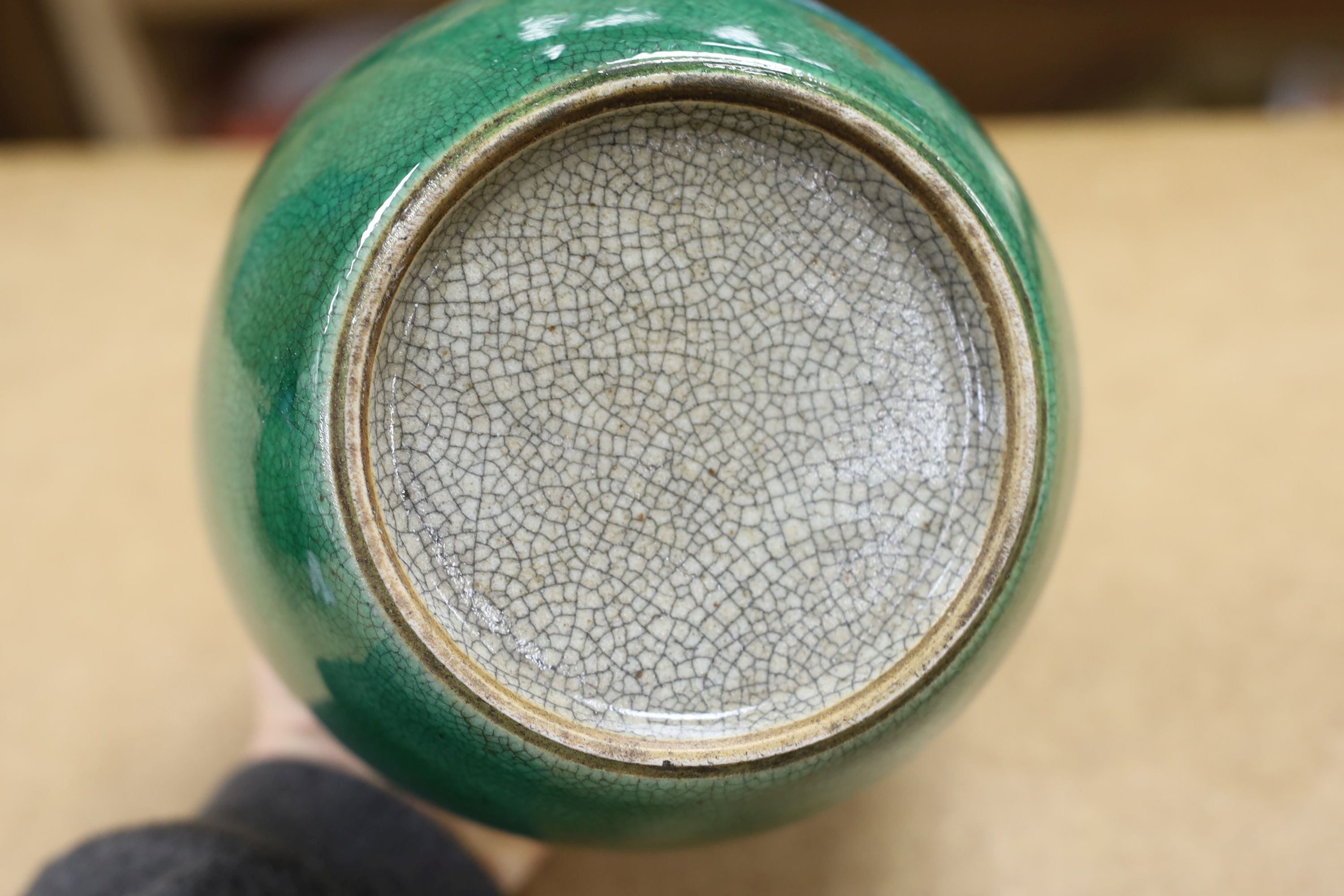 A 19th century Chinese green glazed model of a lion-dog, and two green crackle glaze jars, tallest 16cm